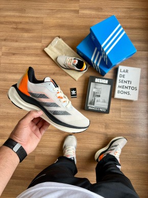 Adizero Boston 12 - Branco/Laranja